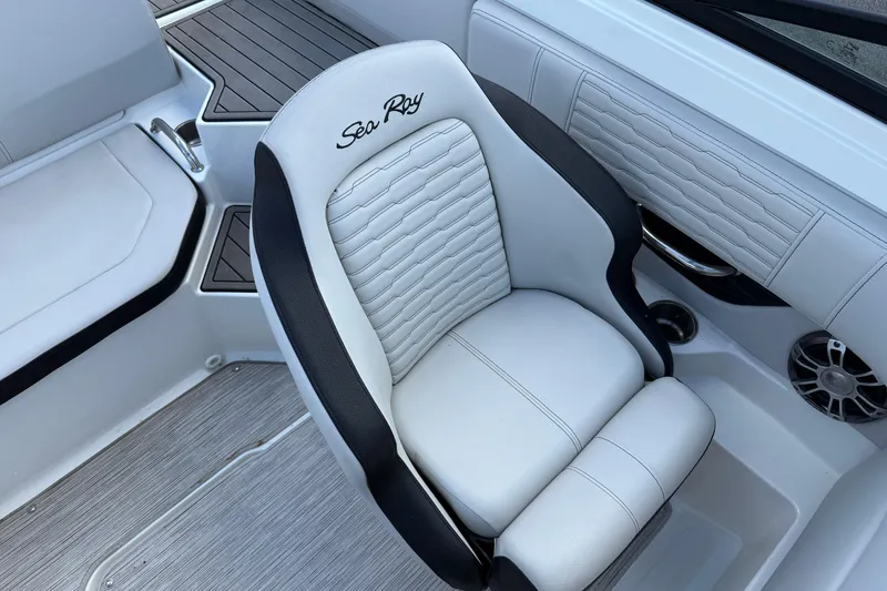 Slide: The Image of 2023 Sea Ray SPX 190 boat interior with white and black cushioned seating. - 10
