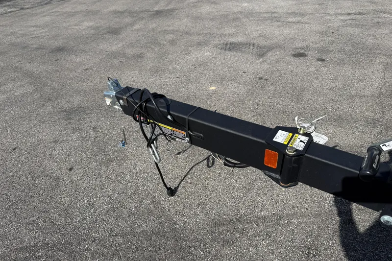 Slide: The Image of Trailer hitch of a 2023 Sea Ray SPX 190 on asphalt surface. - 25