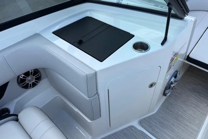 Slide: The Image of Interior of 2023 Sea Ray SPX 190 boat with seating and storage compartment. - 14