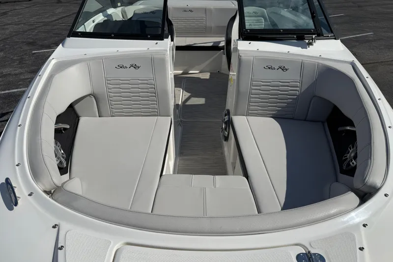 Slide: The Image of 2023 Sea Ray SPX 190 boat interior with white cushioned seating. - 28