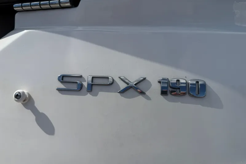 Slide: The Image of 2023 Sea Ray SPX 190 boat emblem on white surface. - 24