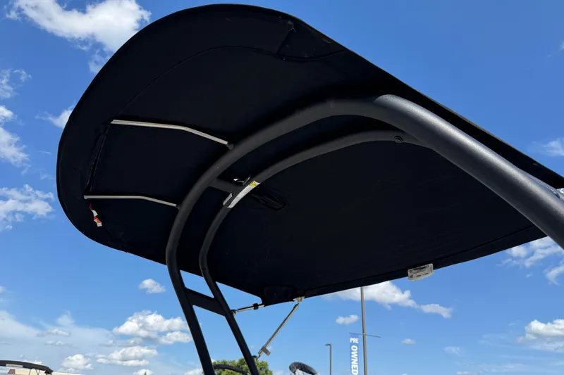 Slide: The Image of 2023 Sea Ray SPX 190 boat canopy against a clear blue sky. - 34