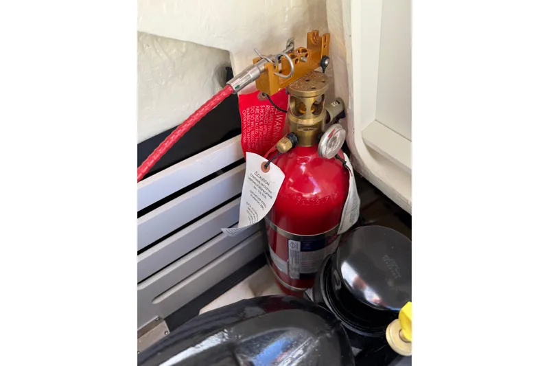 Slide: The Image of Fire extinguisher in 2023 Sea Ray SPX 190 boat compartment. - 19
