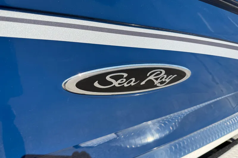 Slide: The Image of 2023 Sea Ray SPX 190 boat logo on sleek blue hull. - 35