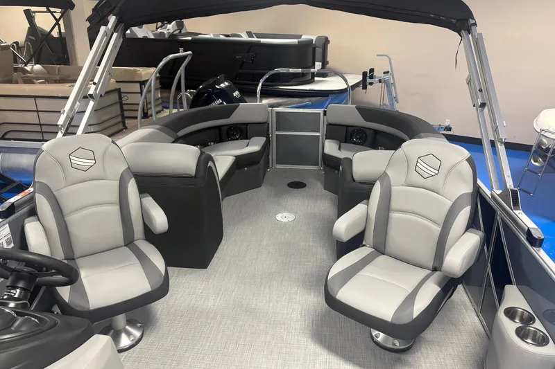 Slide: The Image of 2026 South Bay S224RS pontoon boat interior with gray seating and modern design. - 7