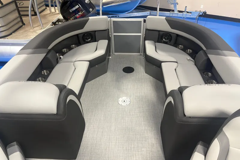 Slide: The Image of Luxurious interior of 2026 South Bay S224RS pontoon boat with plush seating and cup holders. - 5