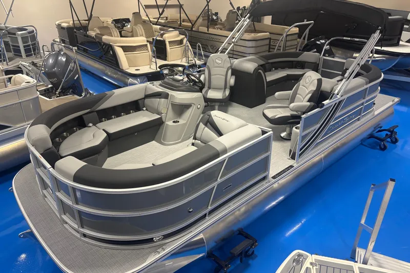 Slide: The Image of 2026 South Bay S224RS pontoon boat with sleek seating and modern design in showroom. - 4