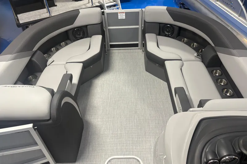 Slide: The Image of Luxurious interior of 2026 South Bay S224RS pontoon boat with plush seating and cup holders. - 6