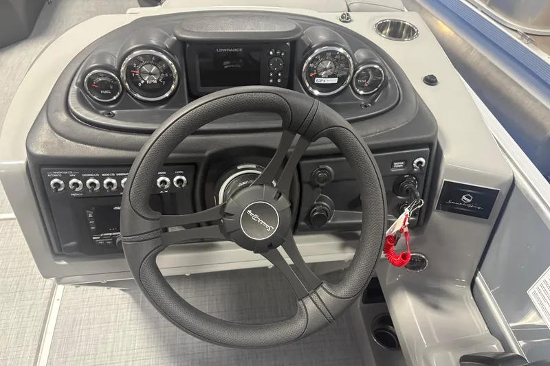 Slide: The Image of 2026 South Bay S224RS boat dashboard with steering wheel and control panel. - 9