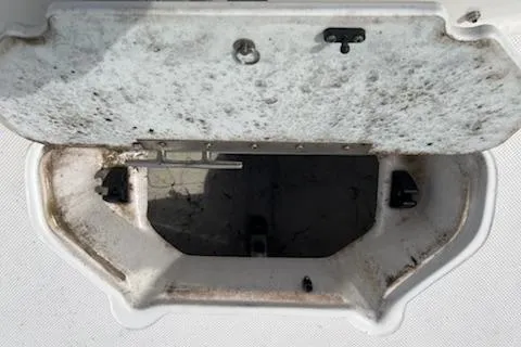 Slide: The Image of Open storage compartment on 2022 Hurricane SunDeck Sport 188 IO boat. - 9