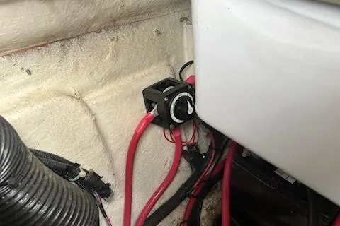Slide: The Image of Battery switch and wiring inside a 2022 Hurricane SunDeck Sport 188 IO boat. - 13