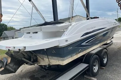 The Image of 2022 Hurricane SunDeck Sport 188 IO boat on trailer, showcasing sleek design and modern features. - 0
