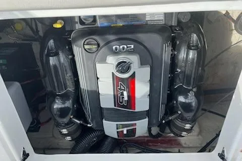 Slide: The Image of 2022 Hurricane SunDeck Sport 188 IO engine compartment with visible components. - 12