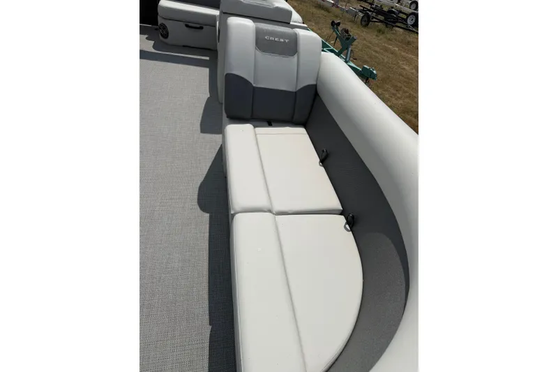 Slide: The Image of 2026 Crest Conquest SE220 Cruise boat interior with gray and white seating. - 5