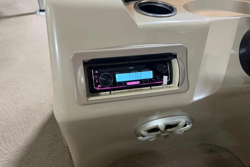 Slide: The Image of Stereo system in a 2010 Bennington 20 SLI boat console with cup holders. - 17