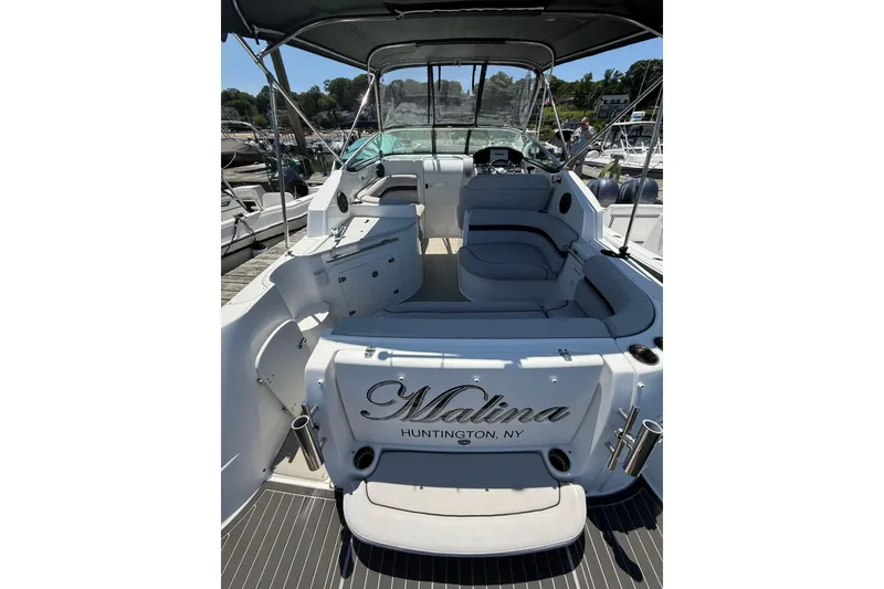 Slide: The Image of 2020 Rinker 270 Express Cruiser boat interior with seating, docked in Huntington, NY. - 12