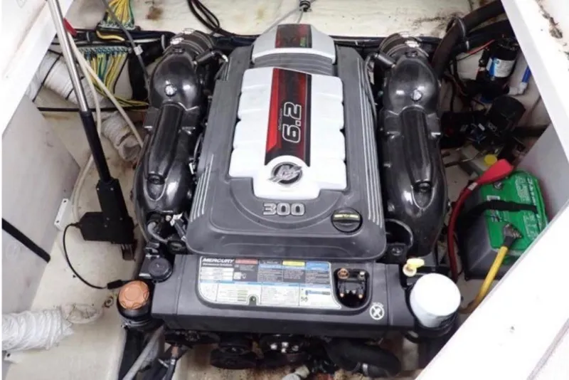 Slide: The Image of Engine compartment of a 2020 Rinker 270 Express Cruiser with a 6.2L Mercury engine. - 10