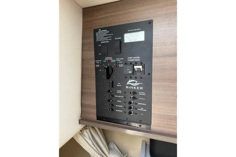 Slide: The Image of Control panel of a 2020 Rinker 270 Express Cruiser, featuring generator and power switches. - 15
