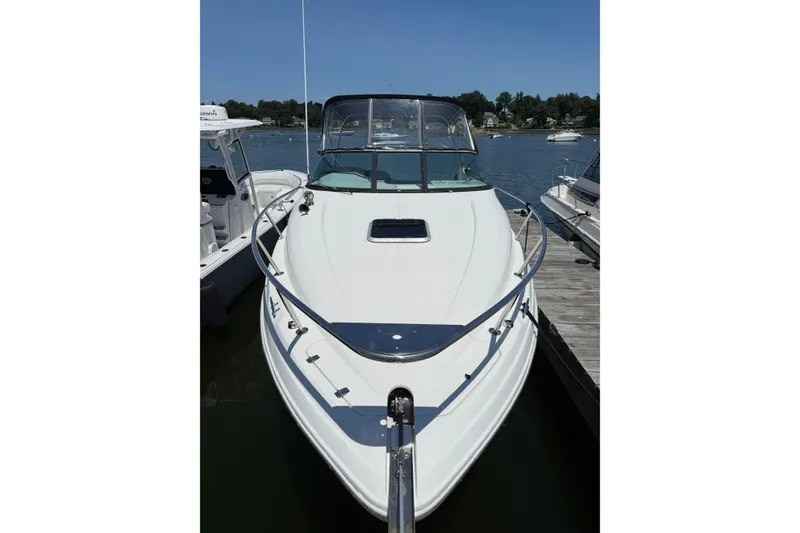 Slide: The Image of 2020 Rinker 270 Express Cruiser docked on a sunny day. - 7