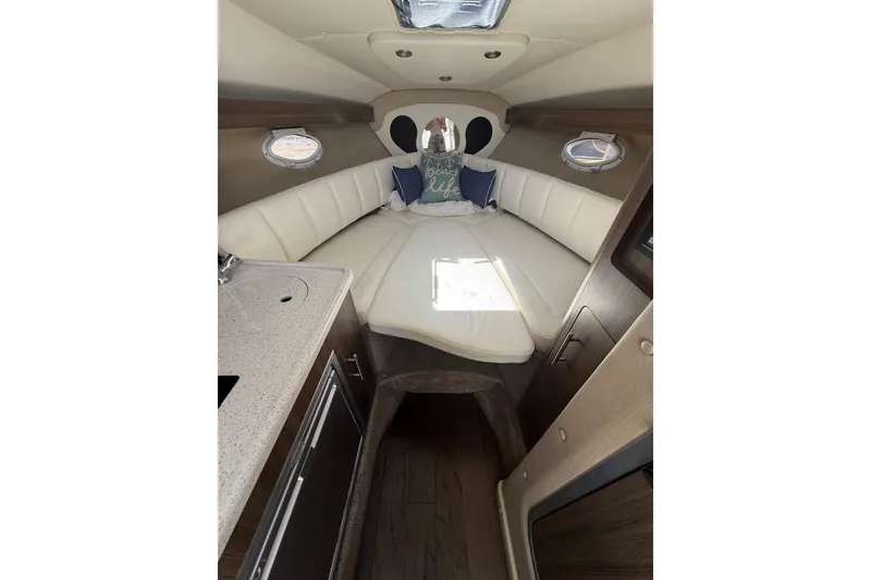 Slide: The Image of Interior of 2020 Rinker 270 Express Cruiser with cozy seating and modern design. - 16
