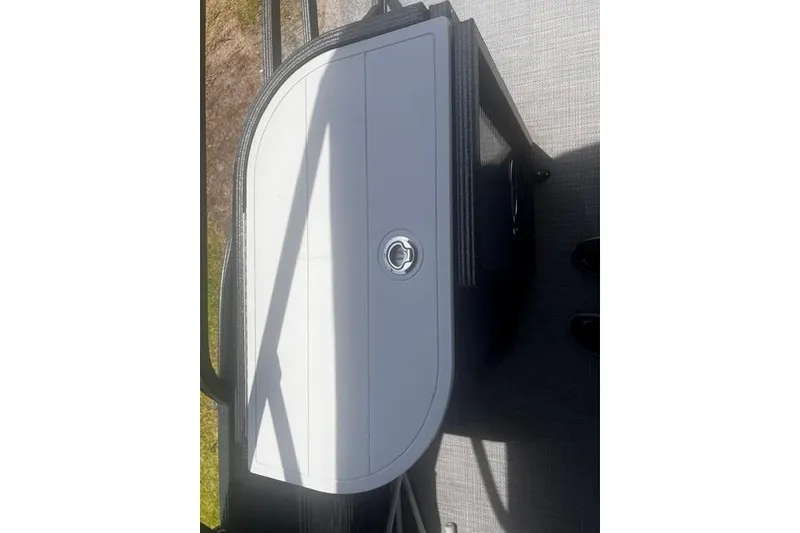 Slide: The Image of 2023 Crest Classic DLX 240 boat storage compartment with a sleek, modern design. - 13