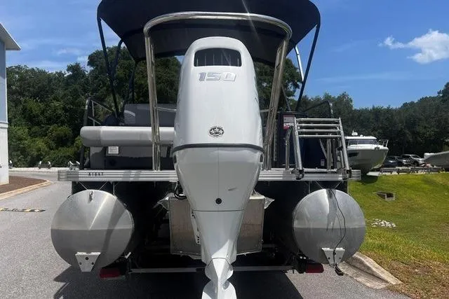 Slide: The Image of 2023 Crest Classic DLX 240 pontoon boat with powerful 150 HP outboard motor. - 5