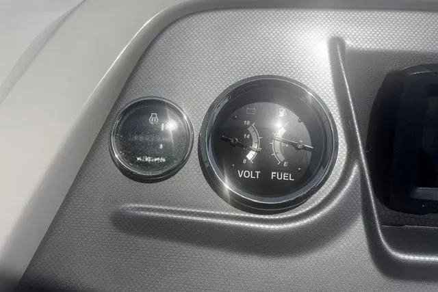 Slide: The Image of Dashboard of 2023 Crest Classic DLX 240 showing volt and fuel gauges. - 8