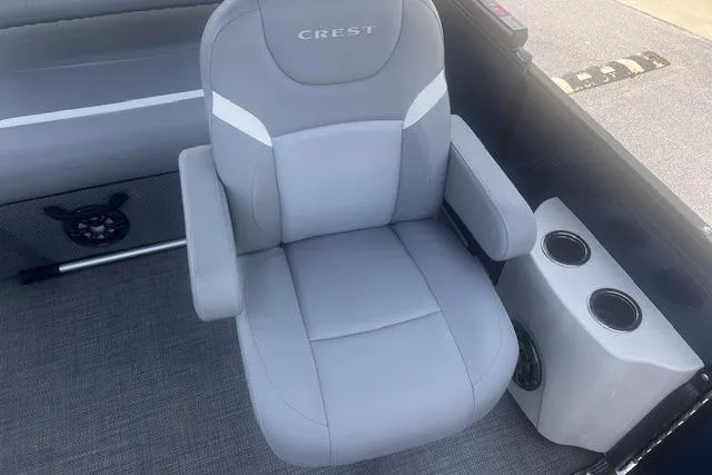 Slide: The Image of Gray captain's chair on 2023 Crest Classic DLX 240 boat with cup holders. - 11