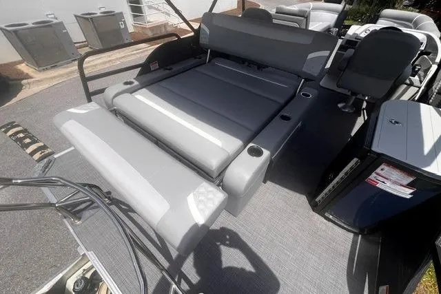 Slide: The Image of 2023 Crest Classic DLX 240 boat interior with gray seating and cup holders. - 15