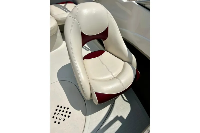Slide: The Image of White and red boat seat in a 2013 Tahoe Q4i, showcasing sleek design and comfort. - 21