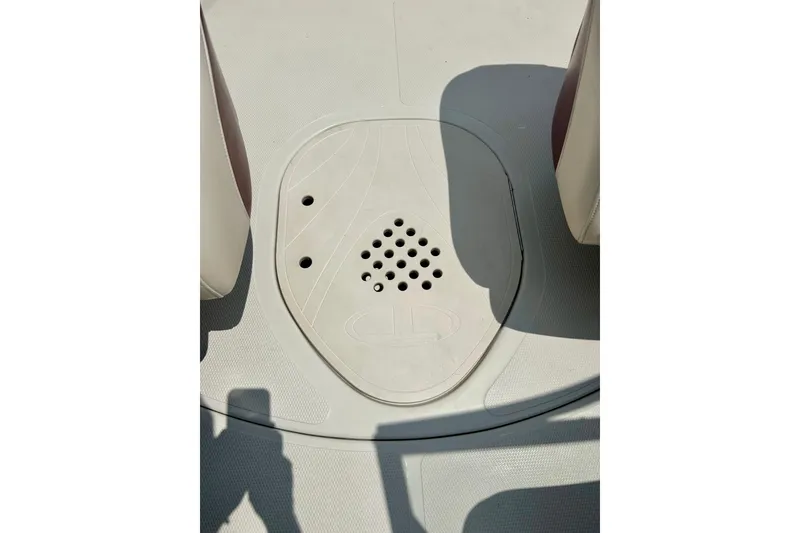 Slide: The Image of 2013 Tahoe Q4i boat deck with drainage holes and shadow. - 11