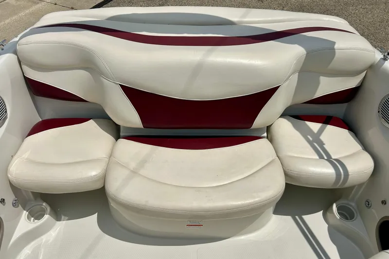 Slide: The Image of 2013 Tahoe Q4i boat interior with white and red cushioned seating. - 27