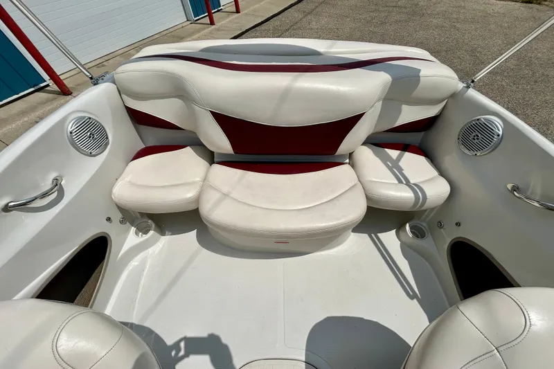 Slide: The Image of Interior of a 2013 Tahoe Q4i boat with white and red seating. - 14