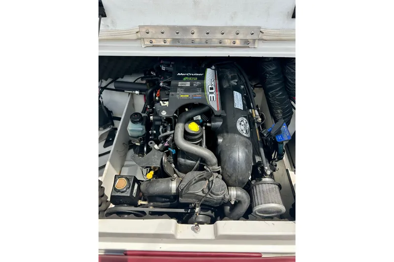 Slide: The Image of Engine compartment of a 2013 Tahoe Q4i boat featuring a MerCruiser 3.0 MPI engine. - 5