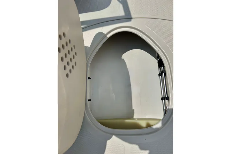 Slide: The Image of Open storage compartment in 2013 Tahoe Q4i boat. - 7