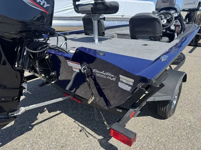 Slide: The Image of A 2021 Tracker Pro Team 175 TF boat with a Mercury outboard motor, parked on a trailer. - 10