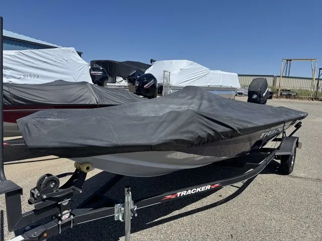 Slide: The Image of A 2021 Tracker Pro Team 175 TF boat, covered and parked on a trailer. - 43