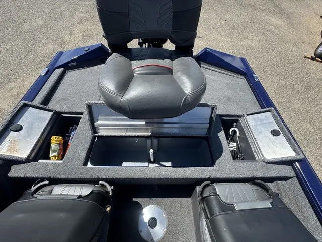 Slide: The Image of The image shows the cockpit of a 2021 Tracker Pro Team 175 TF boat with cushioned seats. - 31