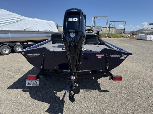 Slide: The Image of A 2021 Tracker Pro Team 175 TF boat with a Mercury 60 HP outboard motor, on a trailer. - 7