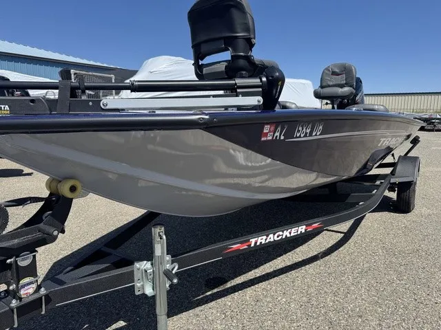 Slide: The Image of A gray 2021 Tracker Pro Team 175 TF boat on a trailer in a parking lot. - 35