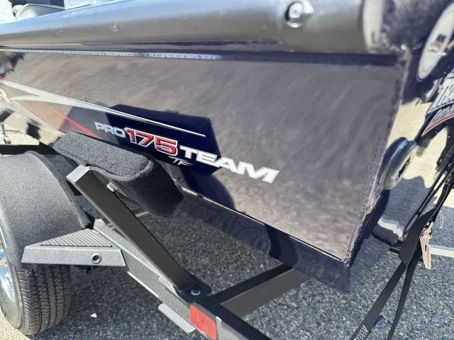 Slide: The Image of Close-up of a Tracker Pro Team 175 TF boat on a trailer, showing the model logo. - 40