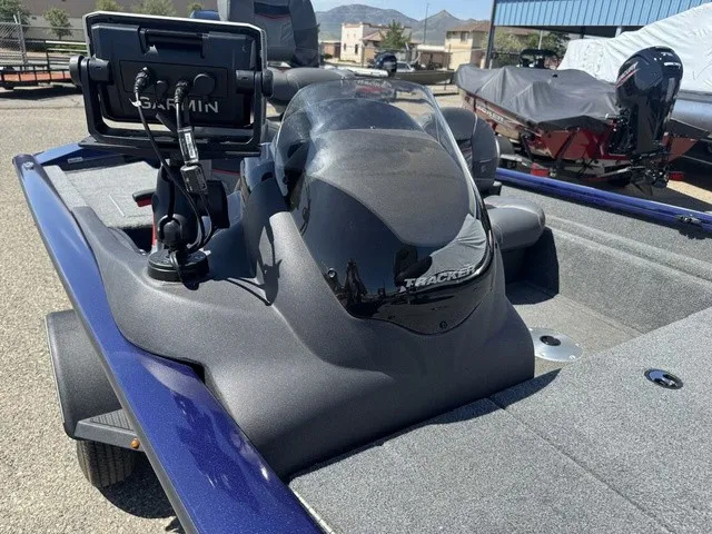 Slide: The Image of The image shows a 2021 Tracker Pro Team 175 TF boat with a Garmin fish finder. - 16