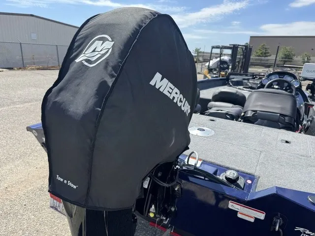 Slide: The Image of A 2021 Tracker Pro Team 175 TF with a Mercury engine, covered and parked outdoors. - 42