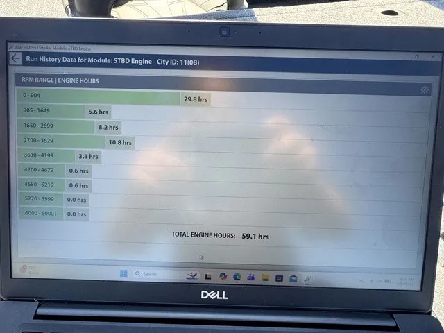 Slide: The Image of A laptop displays engine run history data with various RPM ranges and engine hours. - 44