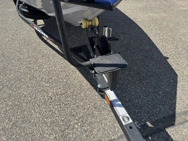 Slide: The Image of Close-up of a boat trailer with a black frame and step on asphalt. - 20