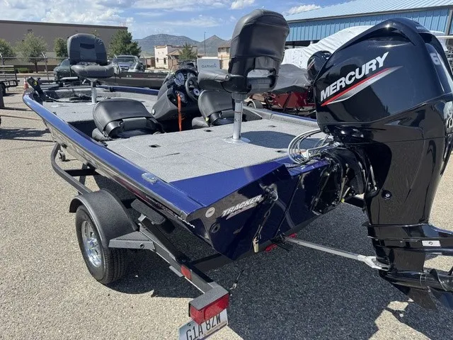 Slide: The Image of A 2021 Tracker Pro Team 175 TF boat on a trailer. It features a Mercury outboard motor. - 41