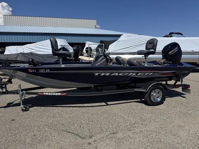 Slide: The Image of A 2021 Tracker Pro Team 175 TF boat on a trailer, parked in a lot. - 33