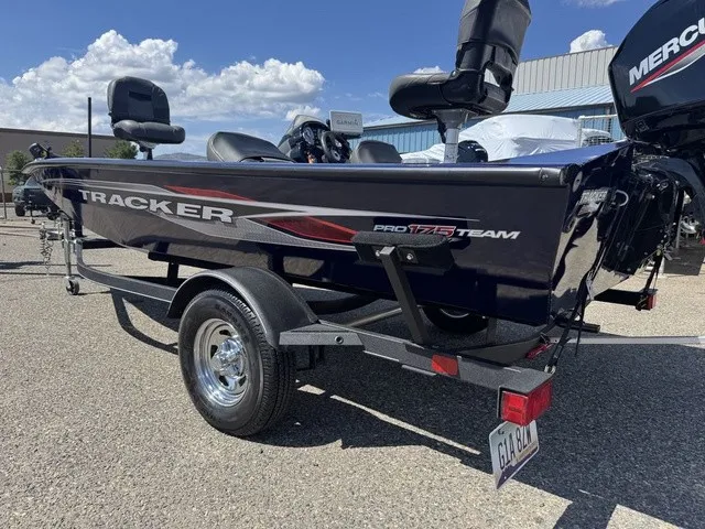 Slide: The Image of A 2021 Tracker Pro Team 175 TF boat on a trailer, featuring a Mercury engine. - 39