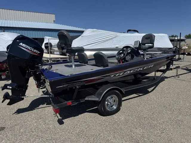 Slide: The Image of A 2021 Tracker Pro Team 175 TF boat on a trailer. It features a Mercury outboard motor. - 5