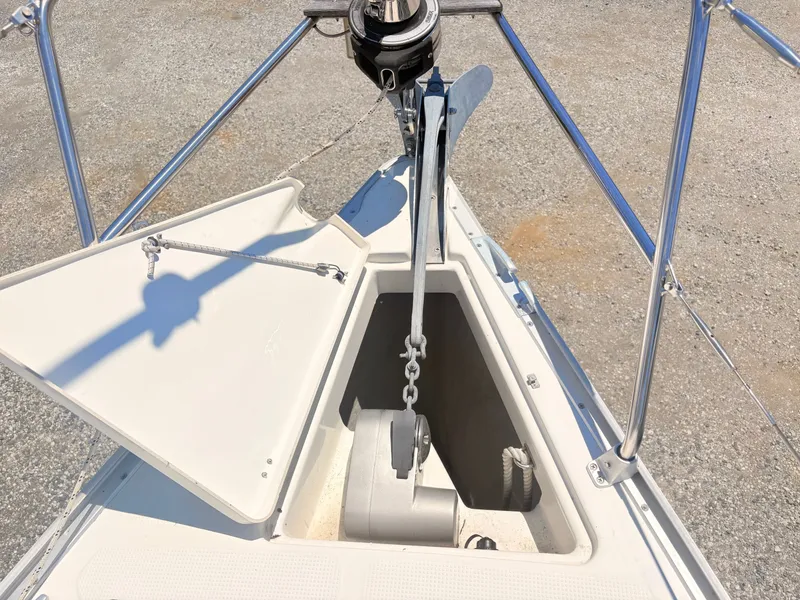 Slide: The Image of The bow of a 2008 Bavaria Cruiser 38 with anchor and anchor locker. - 16